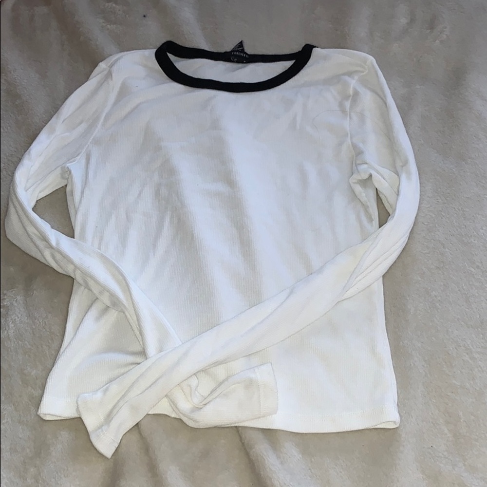 white long sleeve with black skeins neck